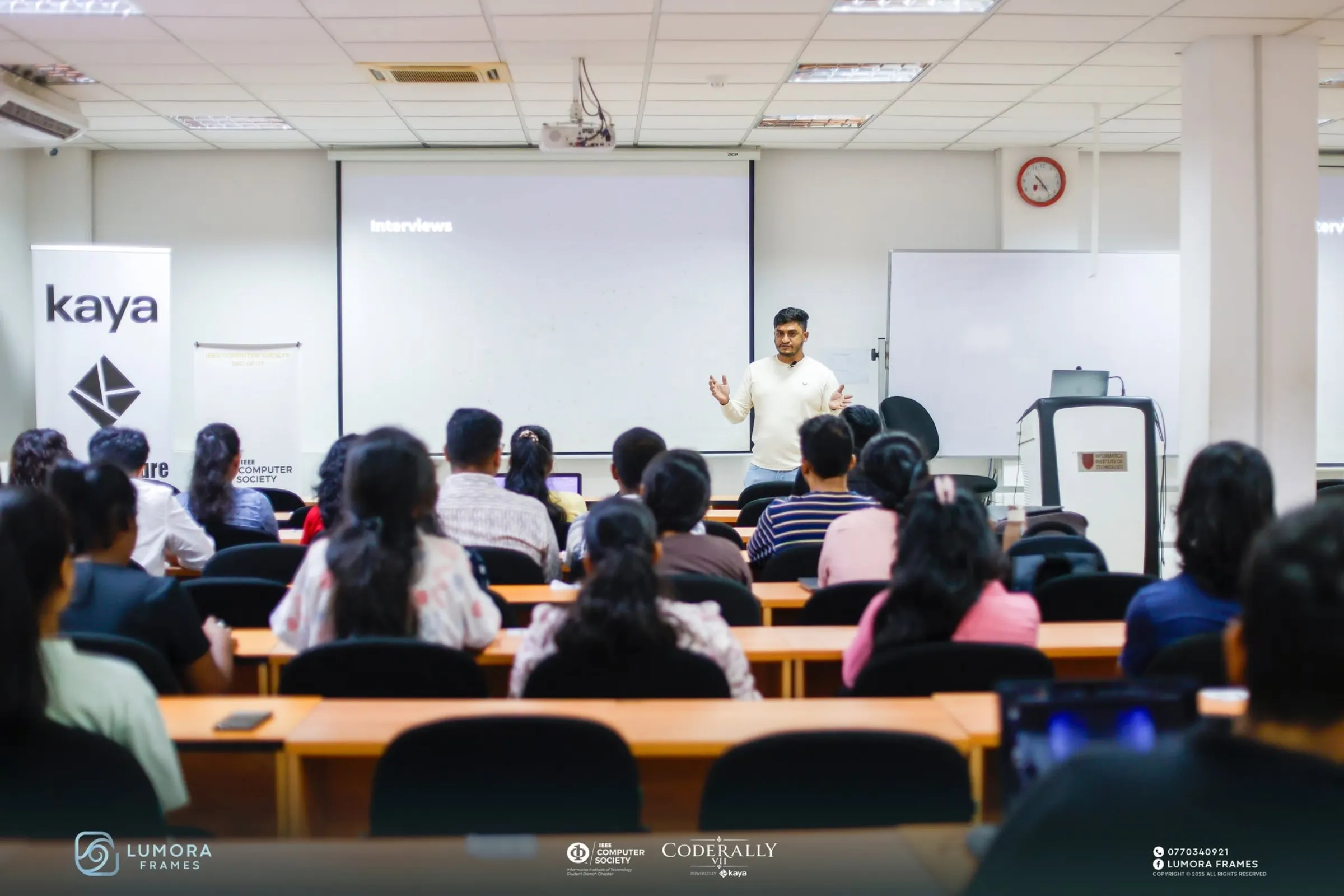 A speaker presenting to a classroom of participants