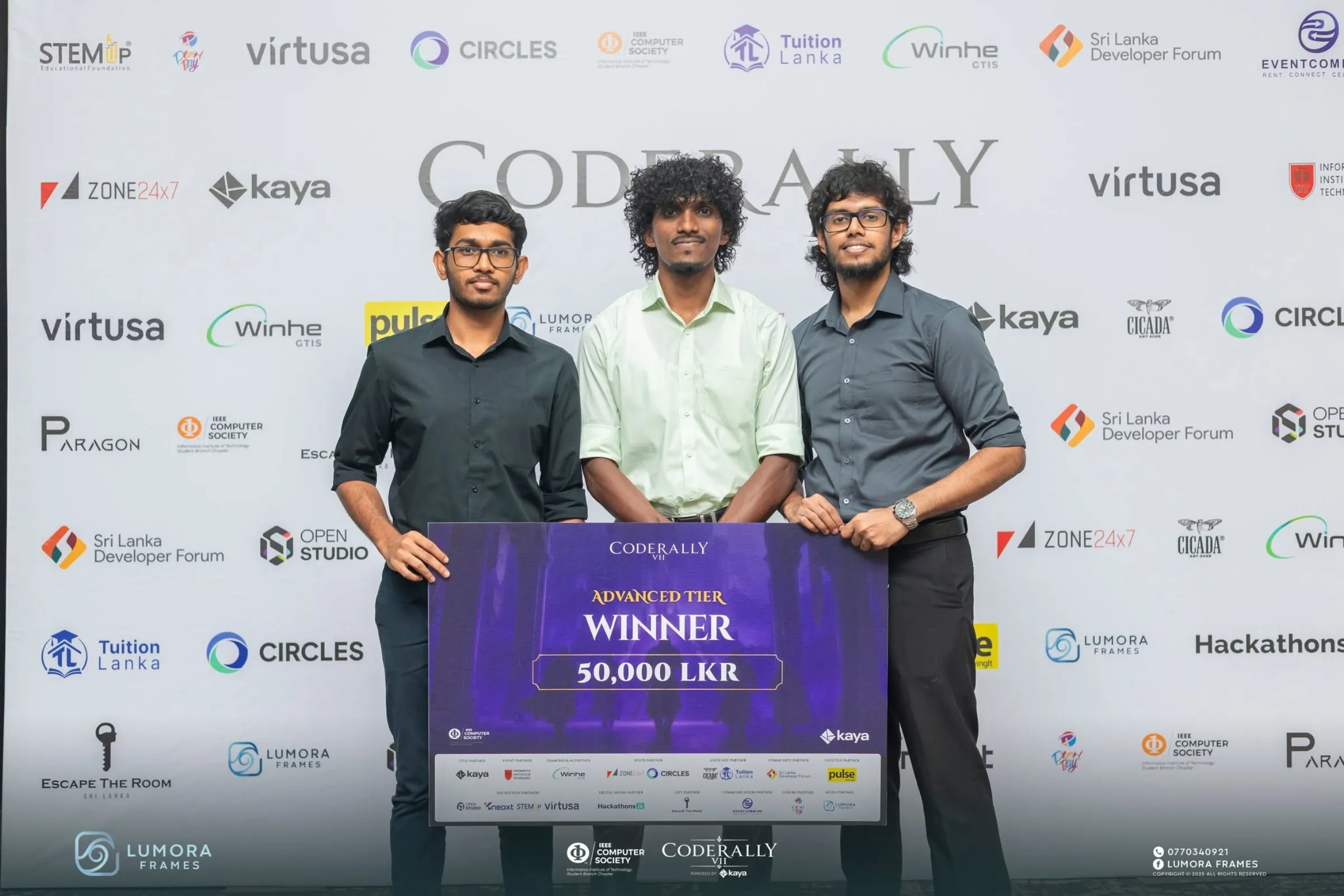 The winning team holding the 50,000 LKR advanced tier cheque