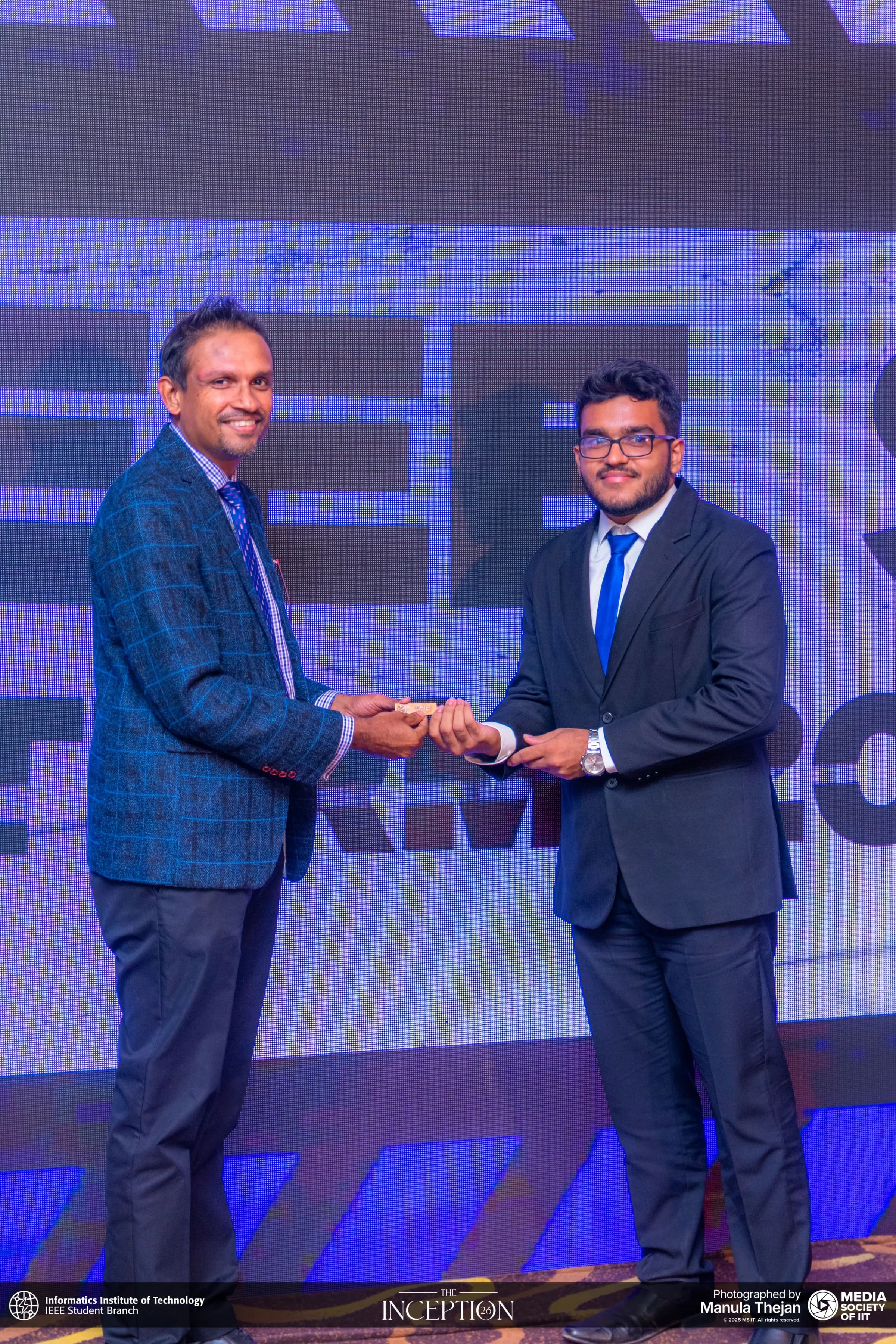 A handover on stage at The Inception 26