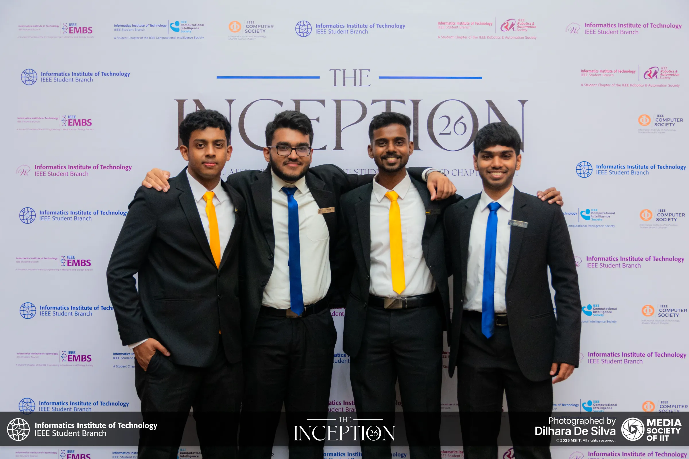 Committee members sharing a laugh at the ceremony
