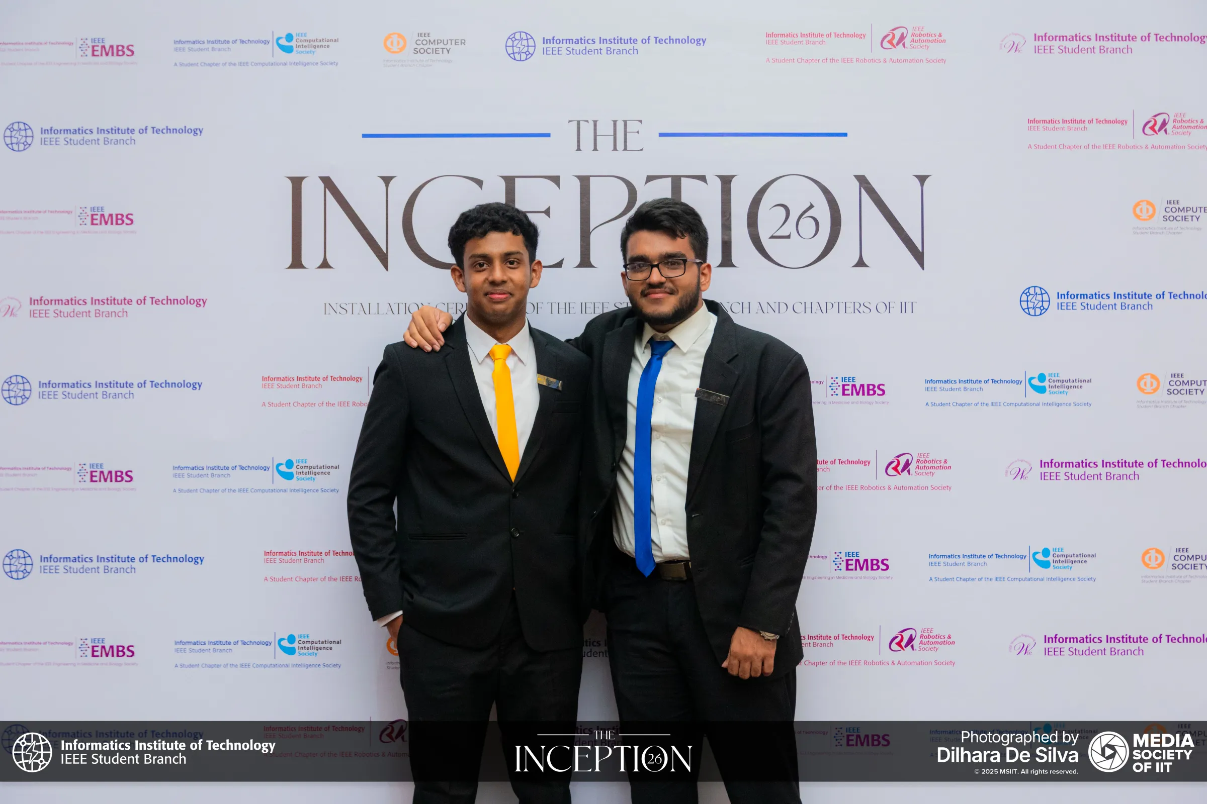 Members of the committee posing in front of The Inception 26 backdrop