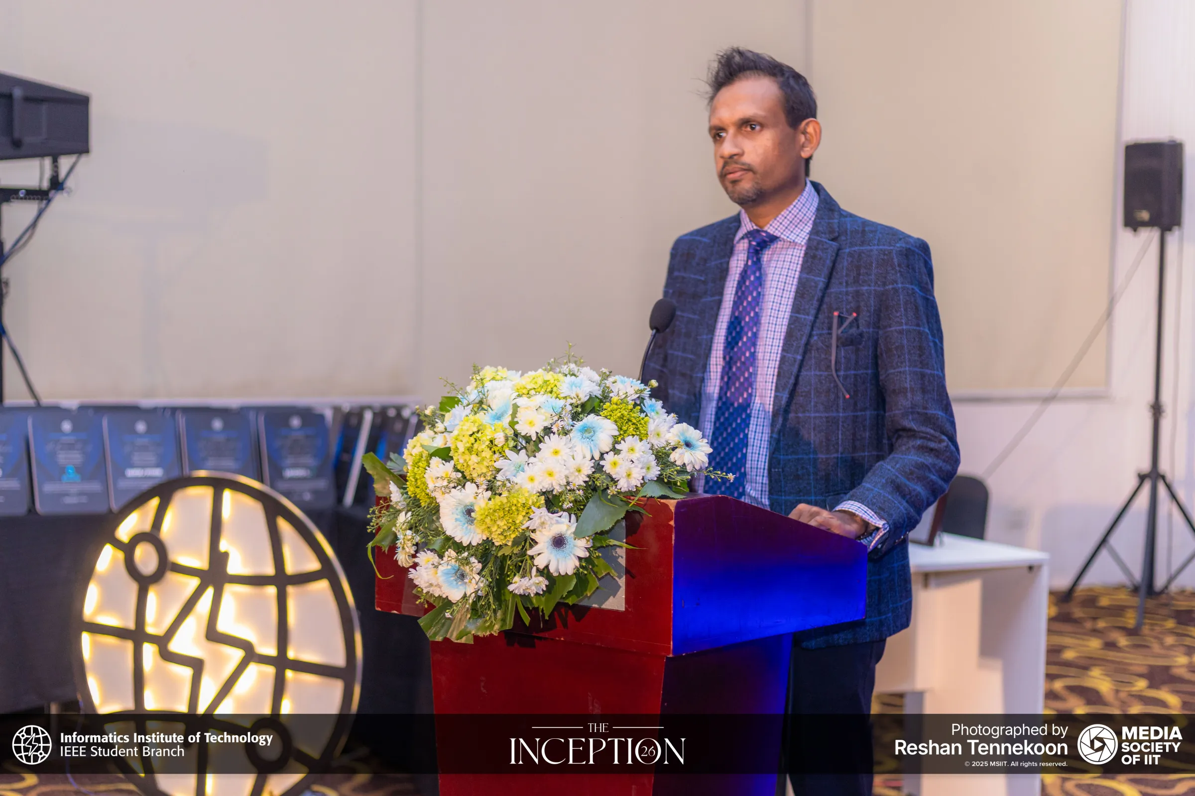 A guest speaking from the podium at The Inception 26