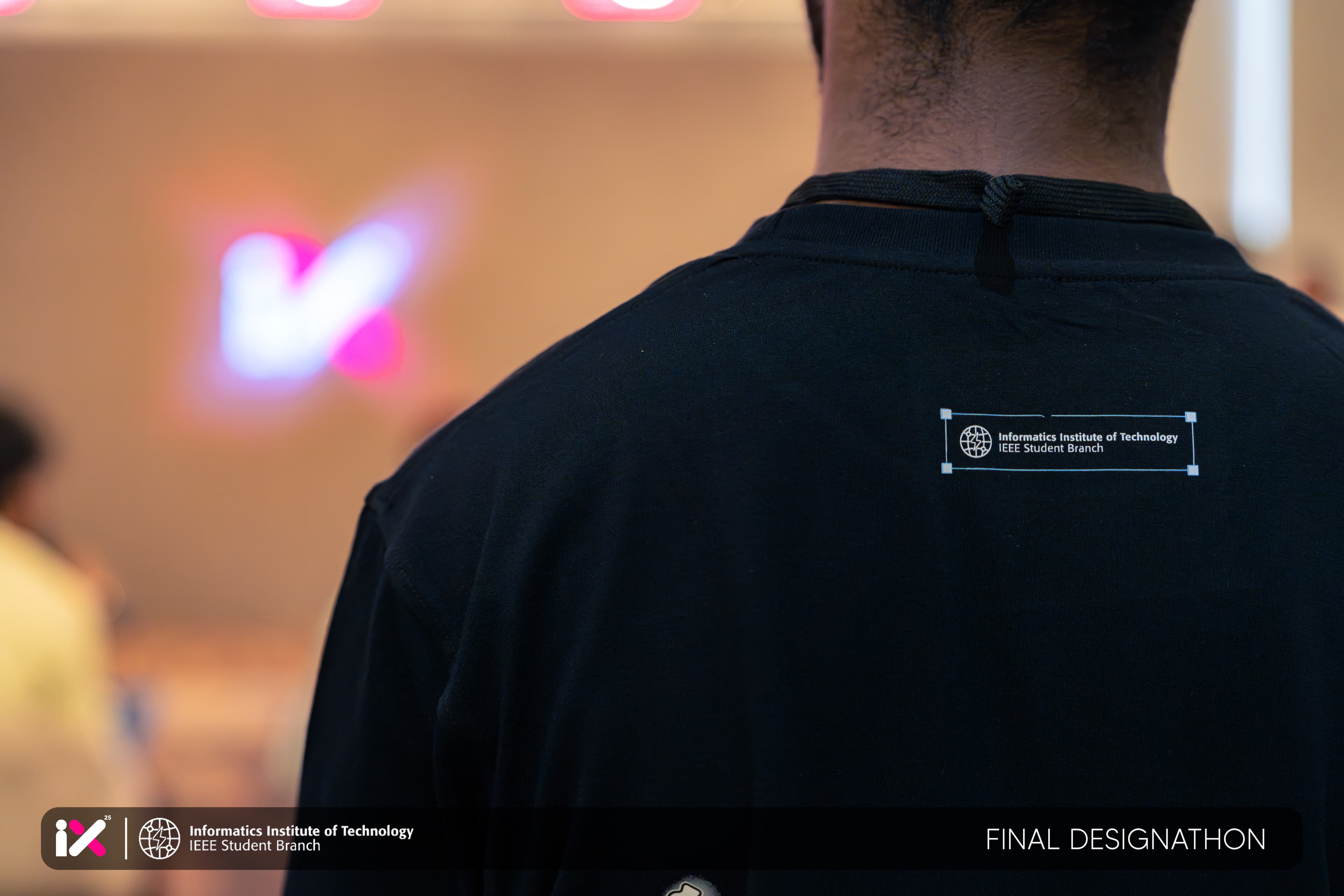 Close-up of an IEEE Student Branch of IIT crew t-shirt at IX 25